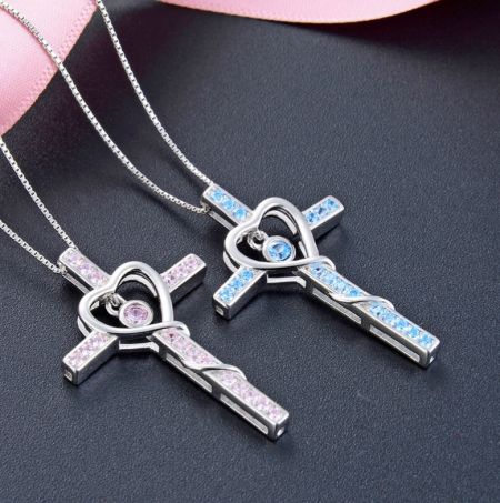 Two 925 Sterling Silver Cross Pendant Necklaces with heart-shaped cubic zirconia, available in different colors.