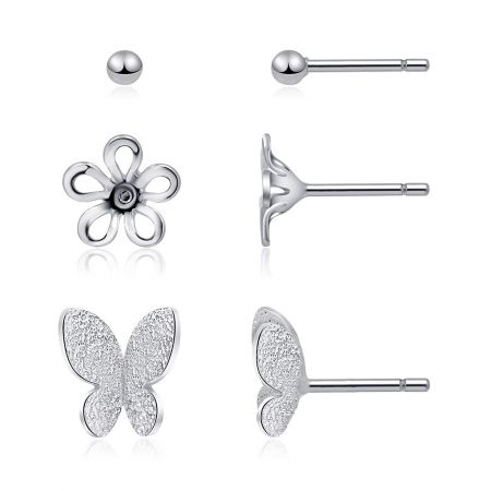 L'ensemble complet de trois boucles d'oreilles puces—boule, fleur et papillon—disposées pour montrer leurs tailles et designs respectifs.