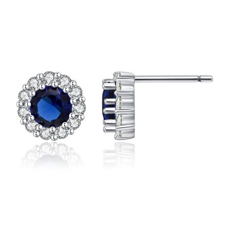 Angled view of the Rhodium Montana Stud Earring, highlighting the sparkle of the cubic zirconia and the rich color of the central Montana glass stone.