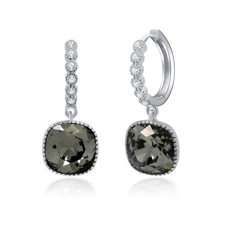 Angled shot of the sterling silver drop earrings, displaying the intricate details of the crystal setting and the black diamond.