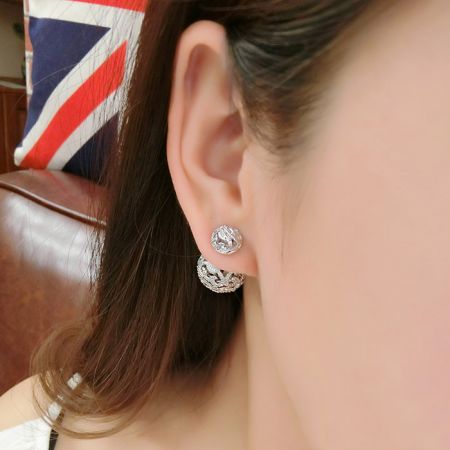 Close-up of a model wearing the Double Ball Pave Diamond Front Back Earrings, emphasizing how they complement the wearer.