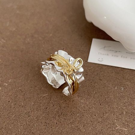 Brass Jewelry Wholesale Gold Silver Adjustable Bow Ring Minimalist Jewelry for Women Statement Brass Gold Plated - Close-up product photo of the two-tone adjustable bow ring in gold and silver, showcasing its minimalist design and polished brass finish.
