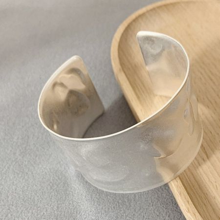 Product shot of the silver hammered cuff bracelet on a white background.
