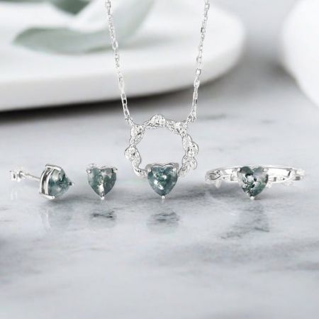 Heart Theme Jewelry Collection - A stunning heart-themed jewelry set by JR Fashion Accessories, featuring a sterling silver necklace, ring, and earrings with heart-shaped stones, perfect for wholesale collections.