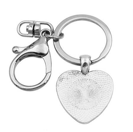 Reverse side of the silver-plated heart keychain, highlighting its sleek and polished stainless steel surface.