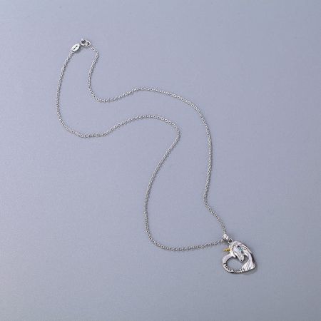 A silver necklace with a heart-shaped pendant featuring a wing design and 'FOREVER' engraving.