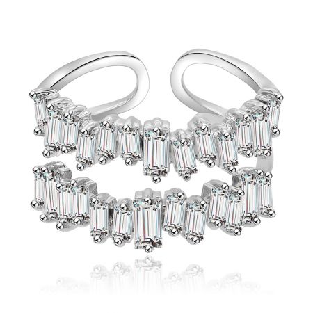 A pair of silver hoop earrings with baguette gemstones, showcasing a complementary style.