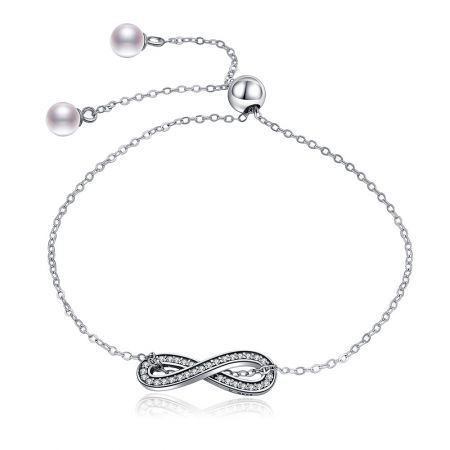 Infinity pave bracelet in sterling silver with a pearl clasp.