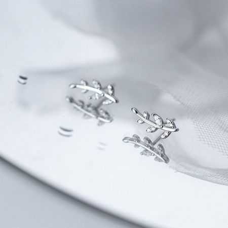 Close-up shot of the 925 silver leaf earrings highlighting the brilliant CZ zircon stones.
