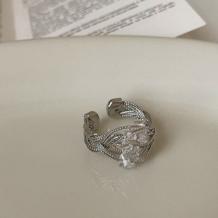 Delicate silver crystal wire-wrapped adjustable brass ring.