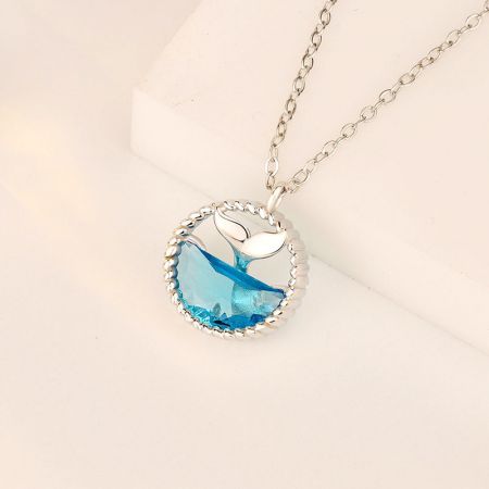 Another angle of the 925 sterling silver whale tail necklace, showcasing its polished finish.