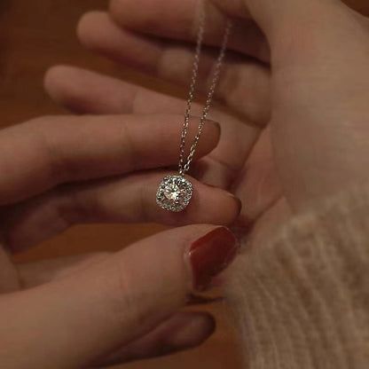 Detailed shot of the clear cubic zirconia gemstone on the silver pendant.