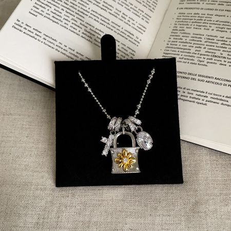 Elegant silver-plated brass chain necklace with an intricately designed padlock pendant.