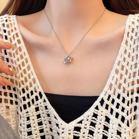 Clean product shot of the silver star necklace on a white background.