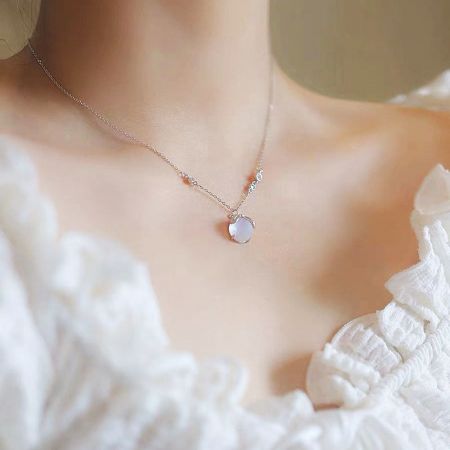 Close-up of the firefly resin stone pendant necklace.
