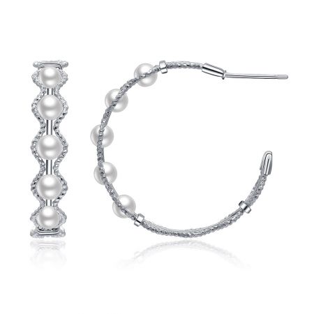 Elegant silver pearl and diamond earrings shown in both hoop and bar designs to display versatility.