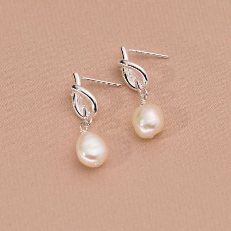 Full view of the 925 sterling silver pearl drop earrings.