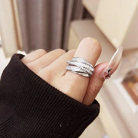 Adjustable Open Silver Multi-Layered Cubic Zircon Brass Rings - A model's hand showcasing the adjustable open multi-layered cubic zirconia brass rings, highlighting their elegant design and fit.