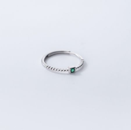 The 925 sterling silver emerald ring shown in a silver finish with anti-tarnish e-coating.