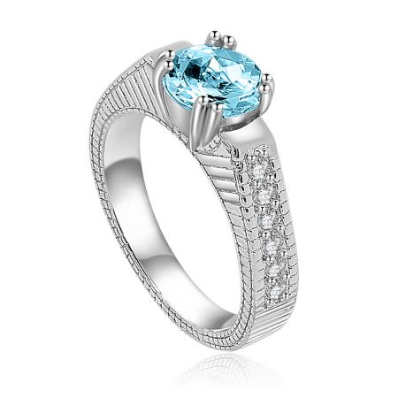 Side profile of the Aquamarine Solitaire Ring, showcasing the detailed craftsmanship of the setting and the sparkling side stones.