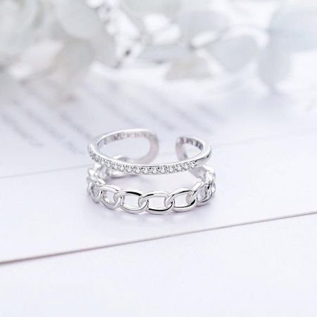 An alternative view of the adjustable open rings, displaying the intricate chain-link and stone-set designs.