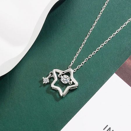 A sparkling silver star pendant necklace featuring brilliant diamond-like zircon stones.
