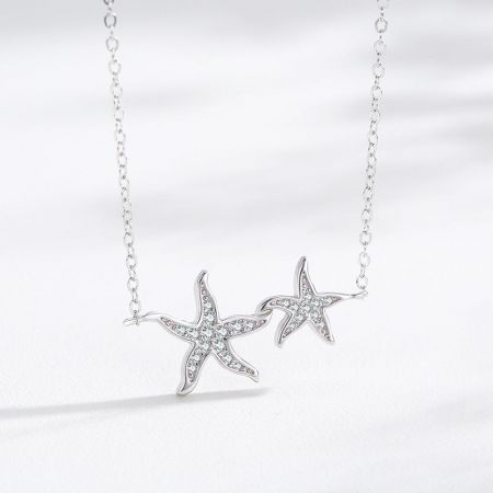 925 Sterling Silver Ocean Sea Two Zirconia Starfish Pendant Necklace Set - A detailed view of the 925 Sterling Silver Starfish Pendant Necklace, highlighting the two pendants adorned with brilliant clear zirconia gemstones.