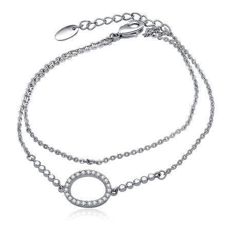 CZ Oval Charm Link Layered Bracelet - The CZ Oval Charm Link Layered Bracelet displayed on a white background, highlighting its double-chain design and the central circular pendant set with brilliant cubic zirconia stones.