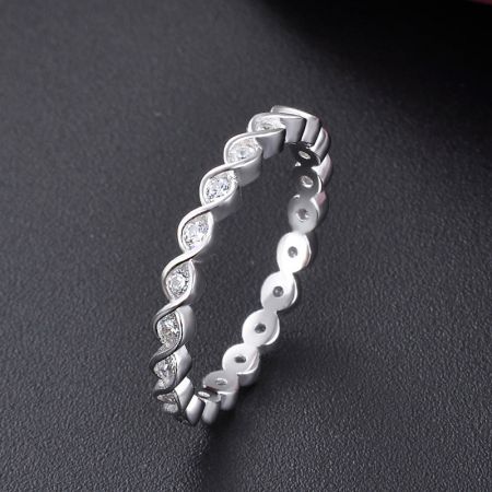A single 925 silver twist ring with cubic zirconia, highlighting the intricate band design.