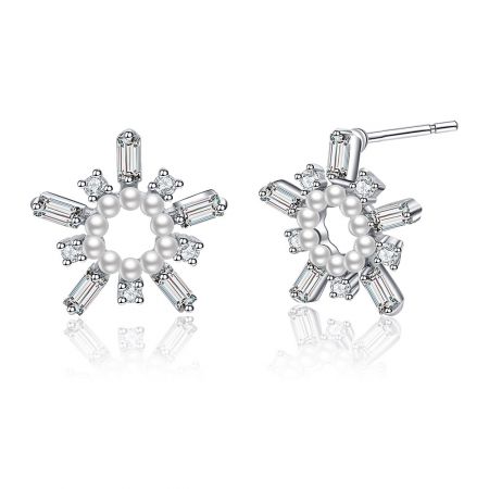 Detailed view of a single White As Snow Pearl Earring, highlighting the central pearl and surrounding cubic zirconia.