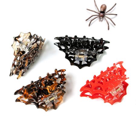 Full collection of spider-themed acetate hair clips in various colors.