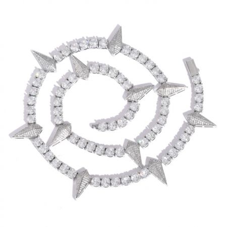 Detailed view of a custom spiral-shaped hip hop jewelry piece with pave-set cubic zirconia.