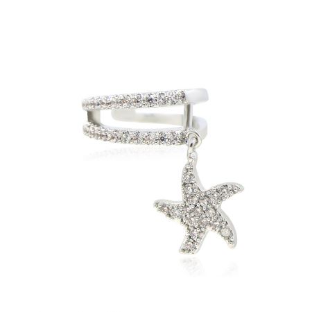 Close-up of a silver starfish mid-ear cuff earring with sparkling gemstones.