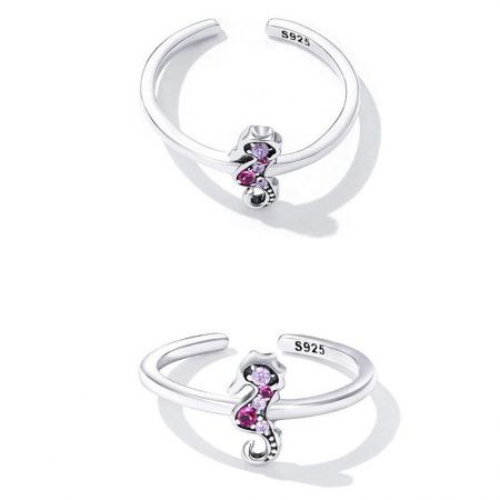 A charming S925 sterling silver ring with a detailed dog design and three small gemstones.