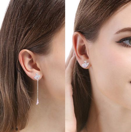 Product shot showcasing two variations of the swan-shaped earrings.