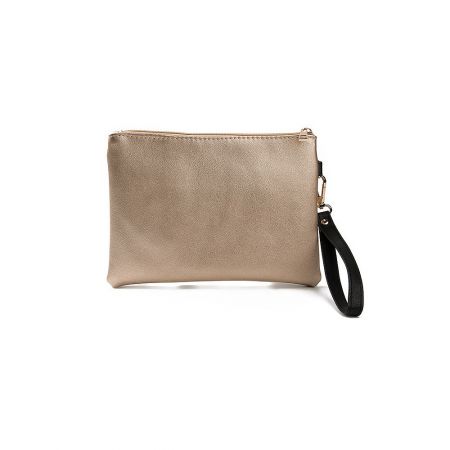Side view of the tan clutch purse highlighting the black wrist strap and sleek profile.