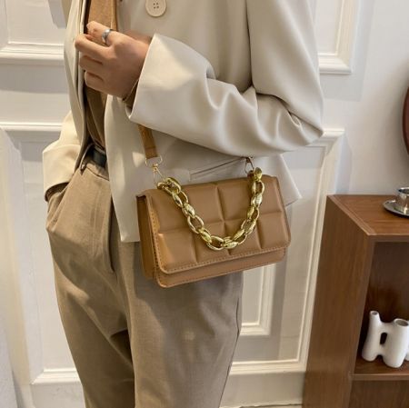 Close-up of the tan version of the Elegant Designer Crystal Chain Handbag with its gold chain.