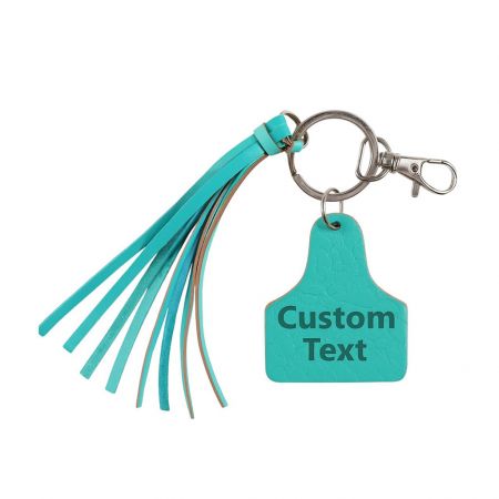 A stylish teal leather keychain with a matching tassel, demonstrating color and accessory customization options.