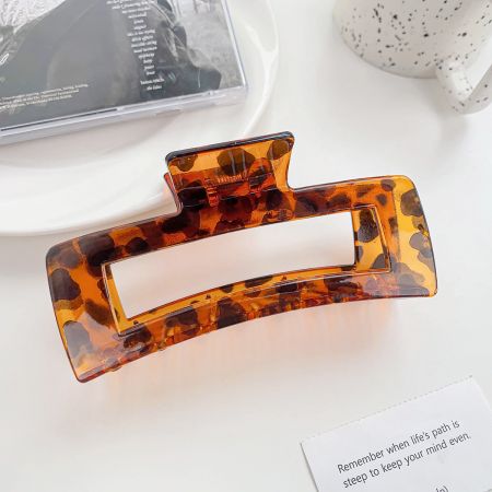 Close-up of a large tortoiseshell hair claw clip.
