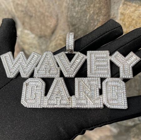 Custom hip hop pendant with 'WAVEY GANG' design in sparkling diamonds.
