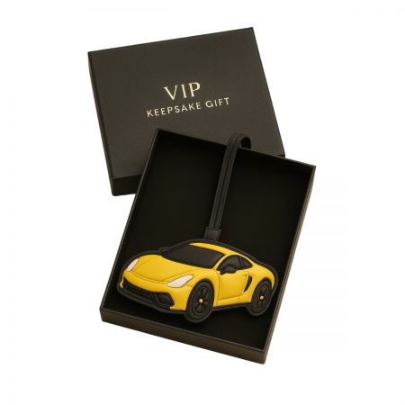 A yellow sports car leather keychain presented in a premium black gift box, ideal for corporate gifting.