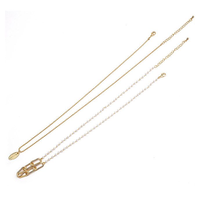 Elegant White Pearl Strand Necklace with a two-layer gold-plated chain, style JRN-032, displayed on a neutral background.
