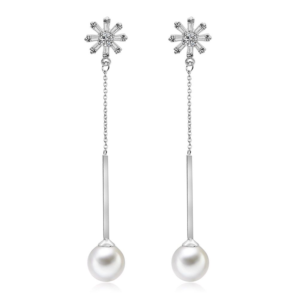 A close-up view of the CZ Simulated Pearl Dangle Earrings, showcasing the intricate silver and crystal details above the lustrous pearl.