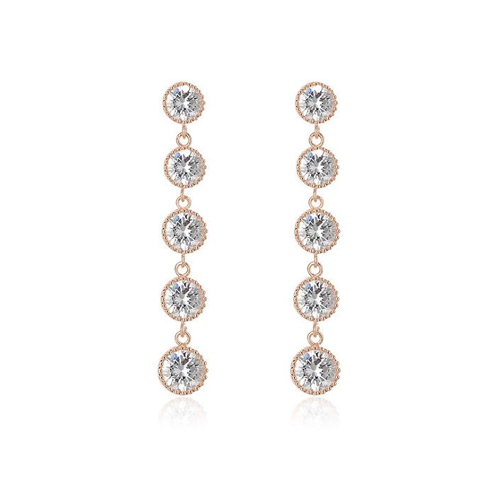Une paire de boucles d'oreilles longues en strass pour mariée (JRE-068) en or rose, présentant un agencement vertical de cinq cristaux transparents et scintillants, parfaites pour les bijoux de mariage.