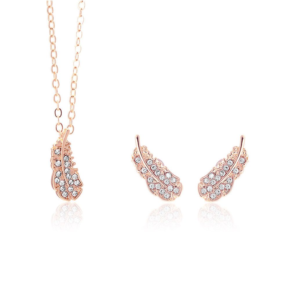 Conjunto de joyería en forma de pluma de oro rosa con piedras preciosas transparentes, perfecto para ropa de novia o accesorios de moda.