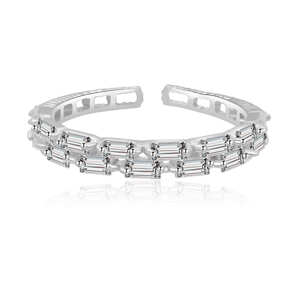 A delicate sterling silver baguette ring with rhodium plating, featuring a row of sparkling cubic zirconia stones, shown against a clean white background.