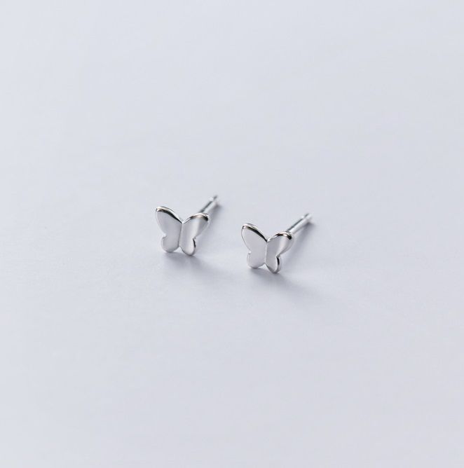 A pair of 925 sterling silver butterfly stud earrings on a white background, showcasing their detailed design.