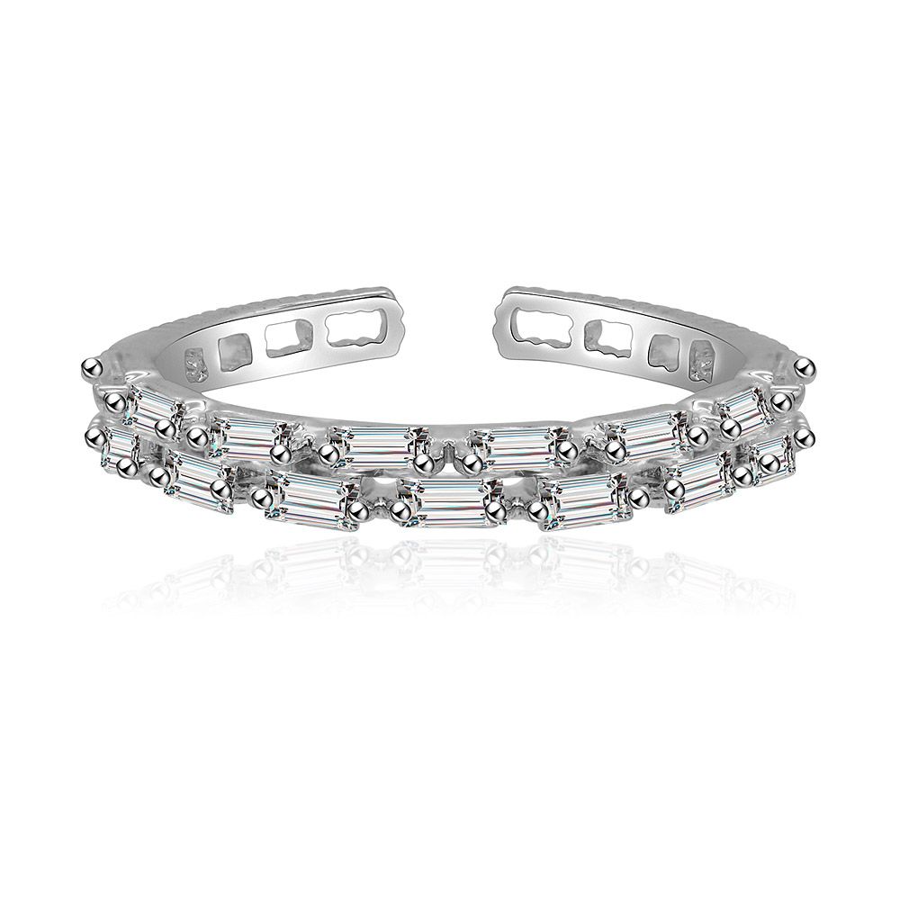 Close-up of the Delicate Baguette Round Ring, showcasing the rhodium-plated brass band set with alternating round and baguette-cut cubic zirconia stones.