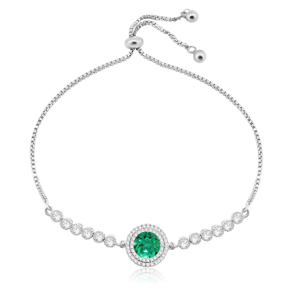 A close-up of the Wholesale Mint Opal Tennis Adjustable Bracelet, showcasing the central green opal glass stone surrounded by a double halo of white cubic zirconia stones on a rhodium-plated brass chain.