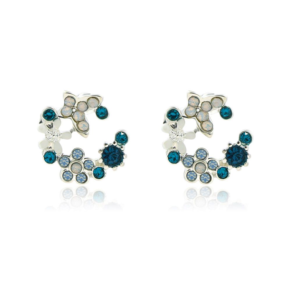 A close-up of the Blue and White Enamel Flower Stud Earrings, showcasing the intricate silver floral pattern with a mix of blue and iridescent crystal stones.